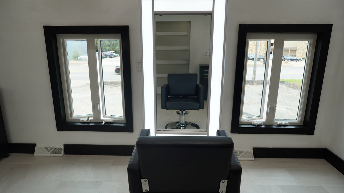 Luxury Strongsville salon suite with designer cabinetry and backwash station
